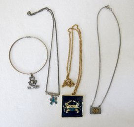 A Grouping Of Cancer Zodiac Jewelry