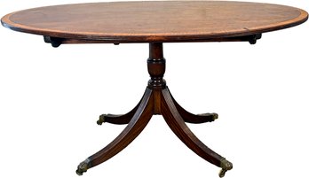 An Antique English Banded Mahogany Tilt-Top Dining Table - Restored