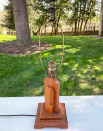 A Vintage Carved Mahogany Lamp