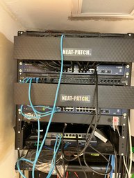 A Collection Of Wall Mounted Voice/Data Racks With Switches