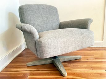 A Modern Swivel Chair In Grey Linen By Hammertown