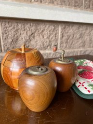 Vintage Grouping Of Salt Shaker, Pepper Grinder, Potholders, And Wooden Apple