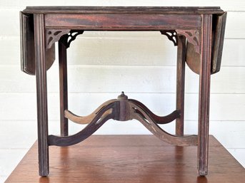 An Antique Mahogany Drop Leaf Side Table