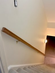 A 153.5' Wood Wall Mounted Handrail