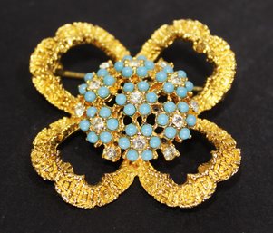 Vintage Gold Tone Clover Brooch Having Turquoise Colored Glass Stones Rhinestones