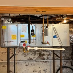 A Unicco AHU And Trane Condensing Unit - Basement/outside