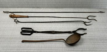 An Assortment Of Primitive Kitchen Tools