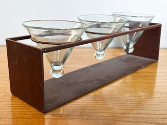 A Set Of Three Modern Hand Blown Martini Glasses On Custom Metal Stand