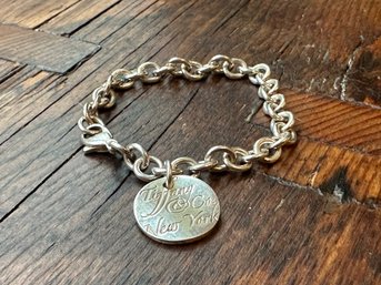 A Vintage Round Tiffany & Co. New York Charm On A 7' Cable Chain Bracelet In Sterling Silver