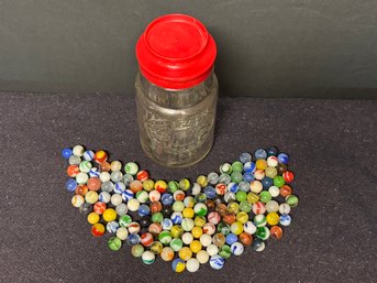Lot Of Vintage Marbles In A 1776 Liberty Bell Glass Jar With A Red Top