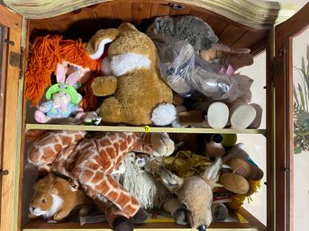TWO SHELVES OF STUFFED ANIMALS