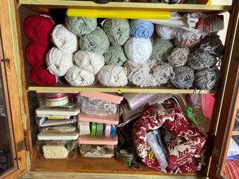 TWO SHELVES AND ONE CABINET OF SEWING ITEMS AND YARN