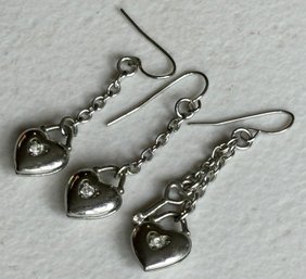 A Trio Of Silver And Rhinestone Earrings