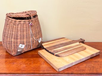 A Fishing Creel And Pair Of Cutting Boards
