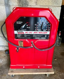 Lincoln Electric AC/DC ARC Welder - Model AC/DC 225125 On Wheel Base & Assorted Welding Rods Included