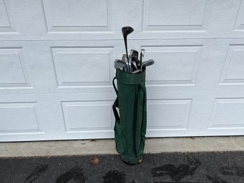 Set Of Golf Clubs In Green Bag Including Set Of Wilson Dyna Power Irons