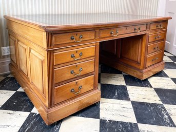 An Antique Leather Top Partner's Desk With Paneled Wood  Sides