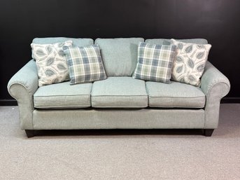 A Pretty Upholstered Three-Seat Sofa