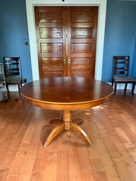 A Round Cherry Finish Table With 1 Leaf - Table Pads *** NOTE PICK UP INFO