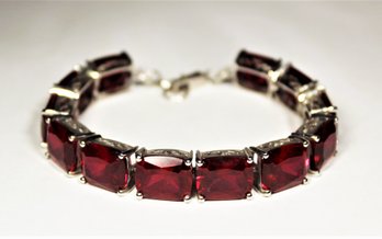 Fine Sterling Silver And Large Faceted Red Gemstone Bracelet