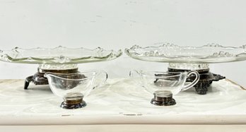A Pair Of Vintage Glass Cake Trays And A Sugar And Creamer With Silver Bases
