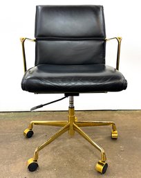 A Vintage Brass Eames Style Swivel Chair