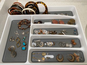 Tray Frull Of Earrings, Scarf Pins, And Bangle Bracelets