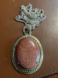 Large Oval Bezel Sunstone Pendant With Silver Tone Setting