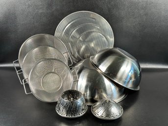 An Assortment Of Stainless Steel Kitchen Ware: Bowls, Strainers, Steamers & More