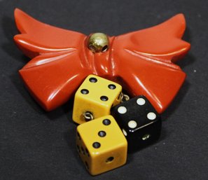 Vintage Red Bakelite Bow Formed Brooch Having Bakelite Dice