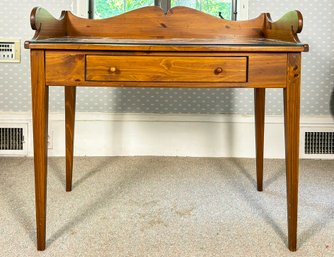 A Rustic Pine Desk With Glass Top By Ethan Allen