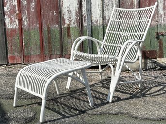 A Faux Wicker Arm Chair And Ottoman