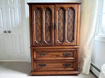 Large Solid Hardwood Armoire With Gothic Style Pulls And Decorative Panel Doors