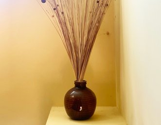 A Large Vase With Faux Floral