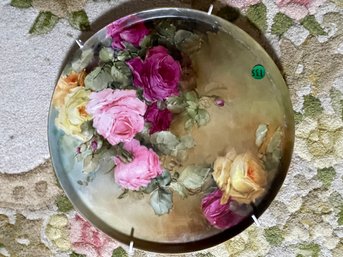A LARGE HAND PAINTED LIMOGE CIRCULAR TRAY