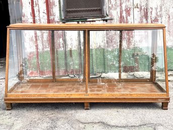 A Late 19th Century Oak And Glass Display Case By Columbus Show Case Company