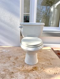 An American Standard Two Piece Toilet With Flushmate 503