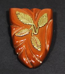 Vintage Carved Bakelite Dress Clip Having Brass Decorative Flower