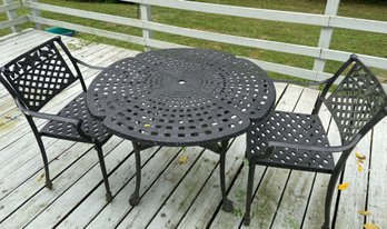 Cast Metal Outdoor Table With Two Matching Arm Chairs