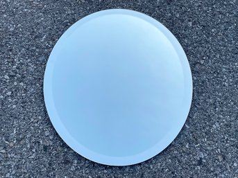 An Oval Beveled Mirror