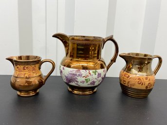 3 Copper Lustre Pitchers 3.5in To 5in