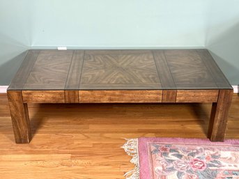 A Modern Coffee Table With Block Legs & A Beautiful Book-Matched Veneer Top With Glass