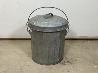 An Ash Bucket In Galvanized Metal