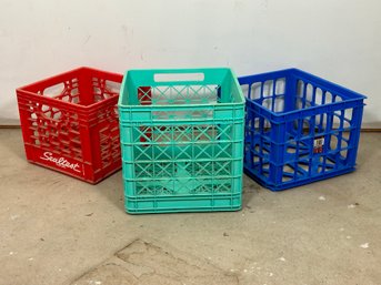 Three Colorful Plastic Storage Crates