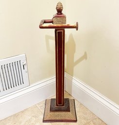 A Bronze Tone Metal Standing Toilet Paper Holder