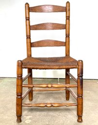 A Turned Oak Rush Seated Ladder Back Chair