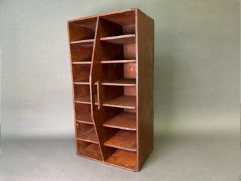 A Vintage Wooden Caddy With Cubbies