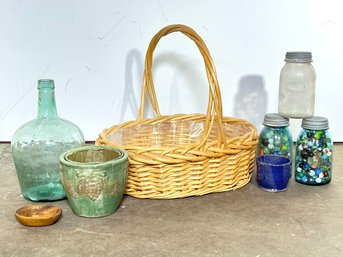 A  Selection Of Decorative Bottles, Baskets, And More