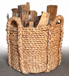 A Large Woven Basket Of Dry Firewood - Stay Warm In Style This Winter!