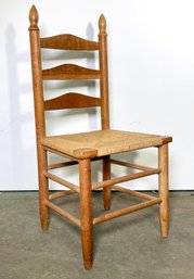 An Oak Ladder Back Rush Seated Chair